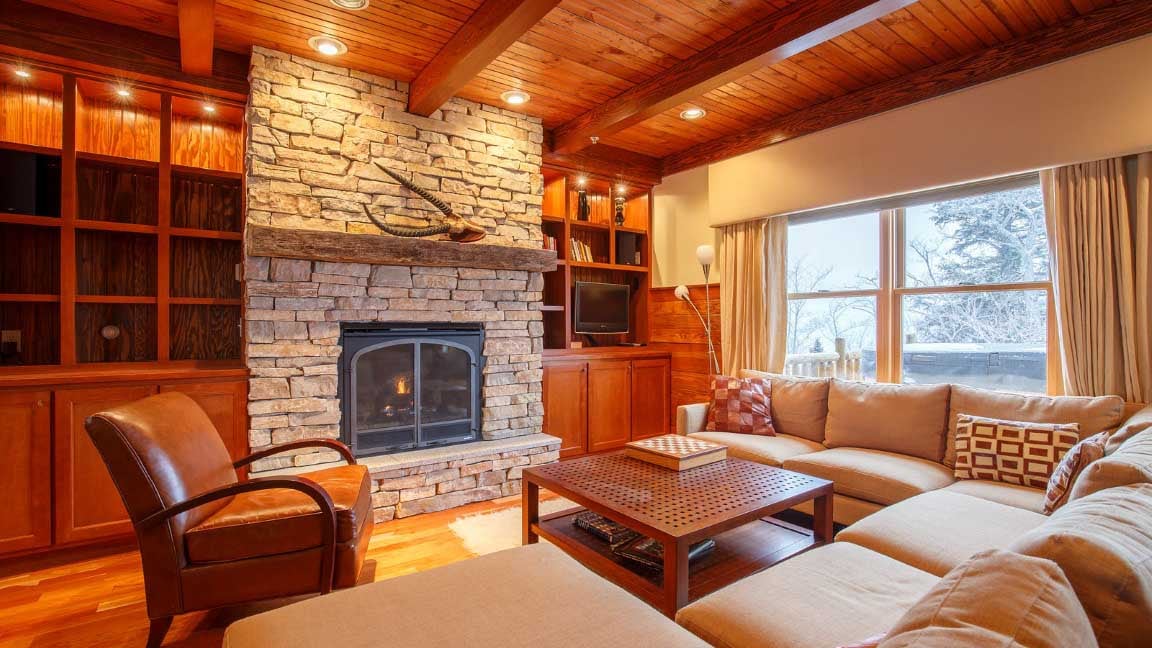 Interior of Timbers Condos: living room with fireplace